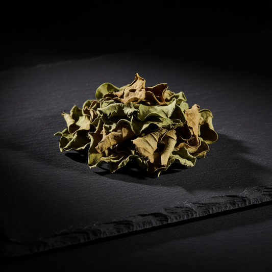 Dried Kaffir Lime Leaves Pile on Black Slate
