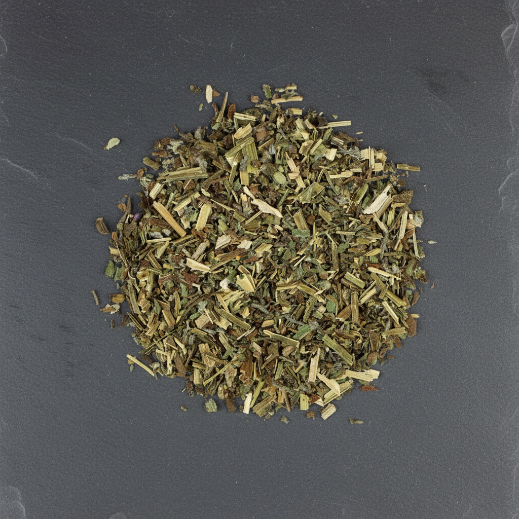 Dried borage herb on a dark gray slate surface