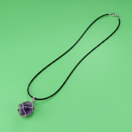 Vinyl Cord with Amethyst Crystal Pendant on Green Background